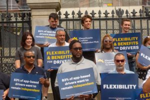 Supporters of flexibility and independence for drivers rally at Massachusetts State House.