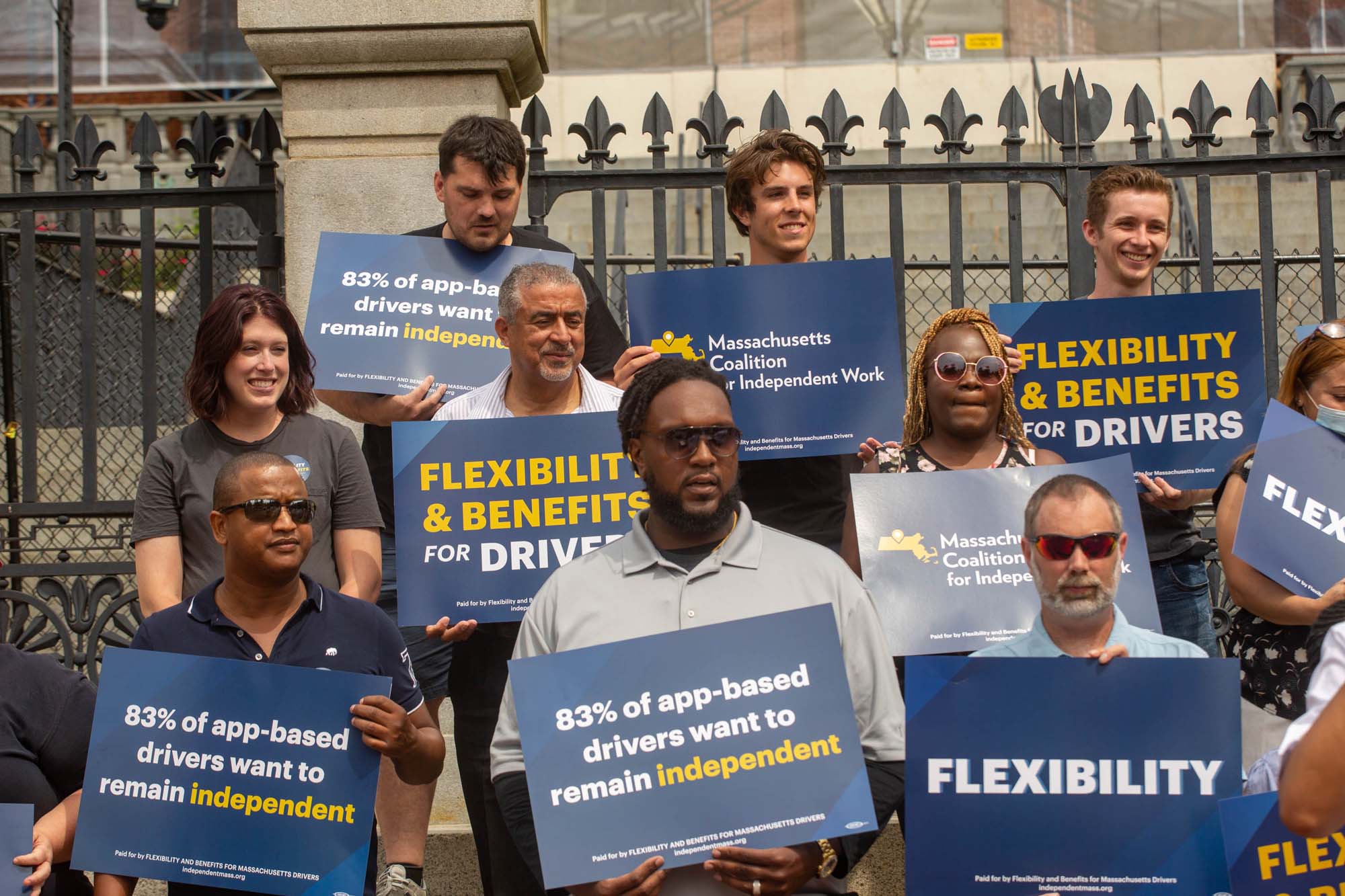 Supporters of flexibility and independence for drivers rally at Massachusetts State House.