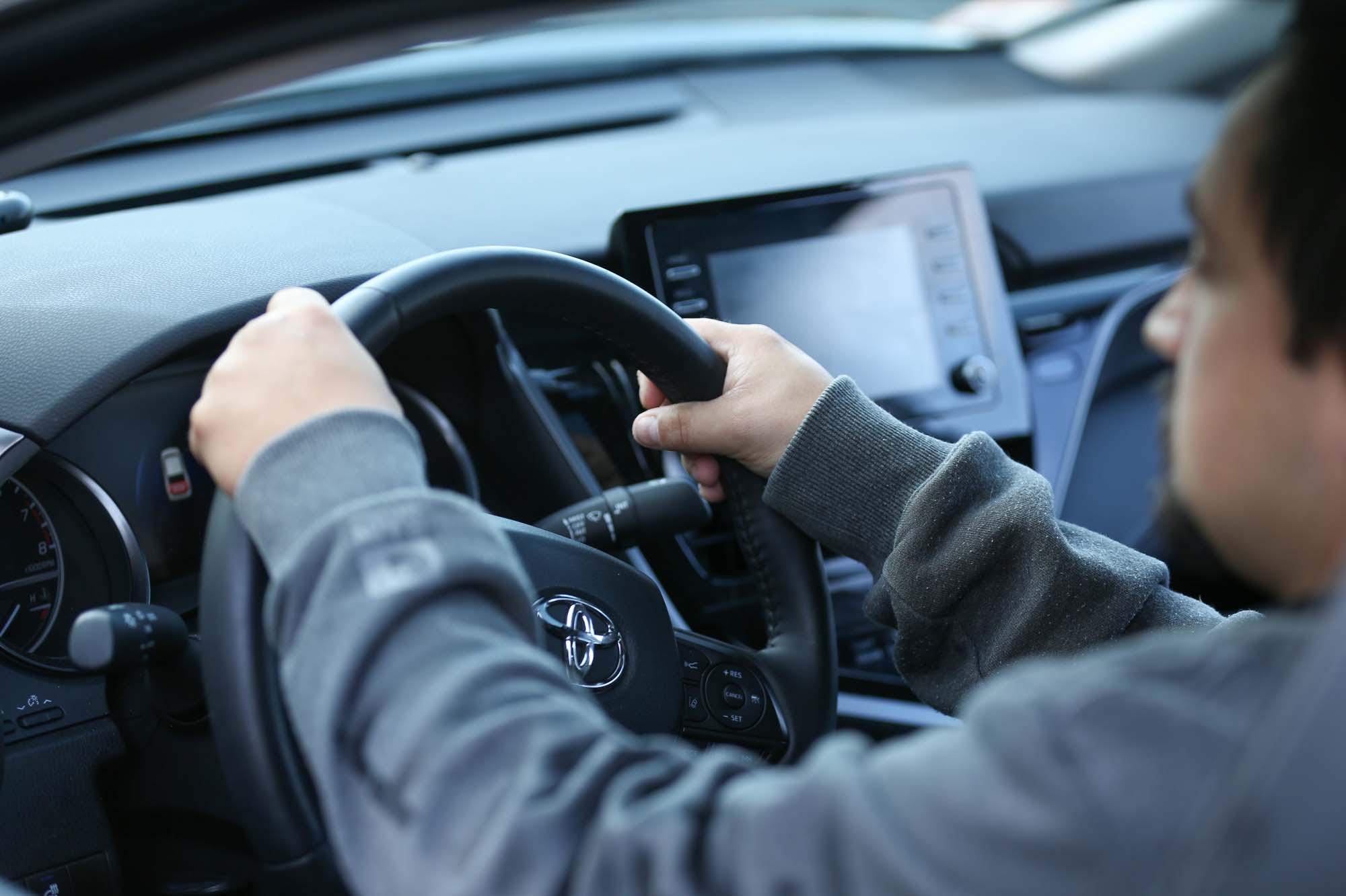 Closeup of hands on steering wheel